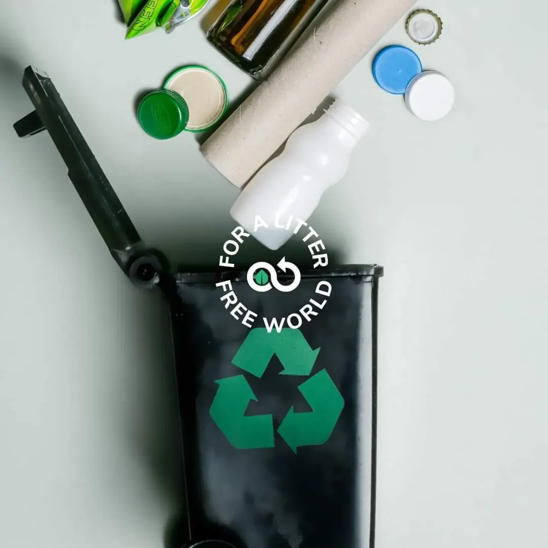 Recycling bin with symbol and bottles representing plastic bottle recycling in Dubai and the UAE Recycling bin with symbol and bottles representing plastic bottle recycling in Dubai and the UAE