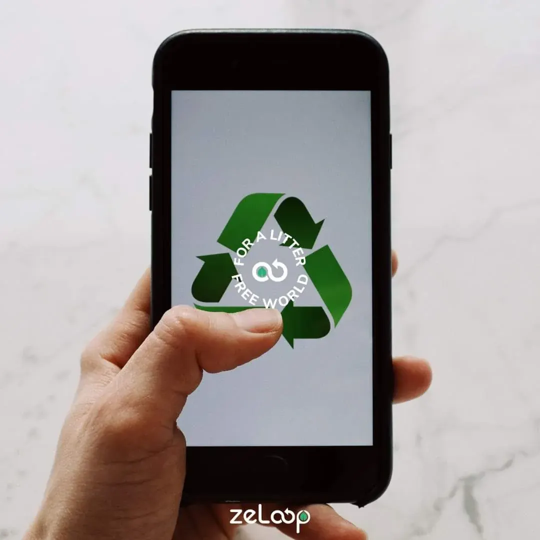 Person holding a smartphone showing a green recycling symbol, suggesting a mobile recycling app in use Person holding a smartphone showing a green recycling symbol, suggesting a mobile recycling app in use